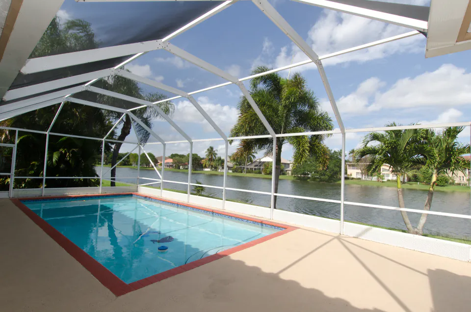 Screened pool enclosure with lake view